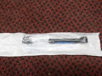 2000 Polaris shock - gas - storage box lid