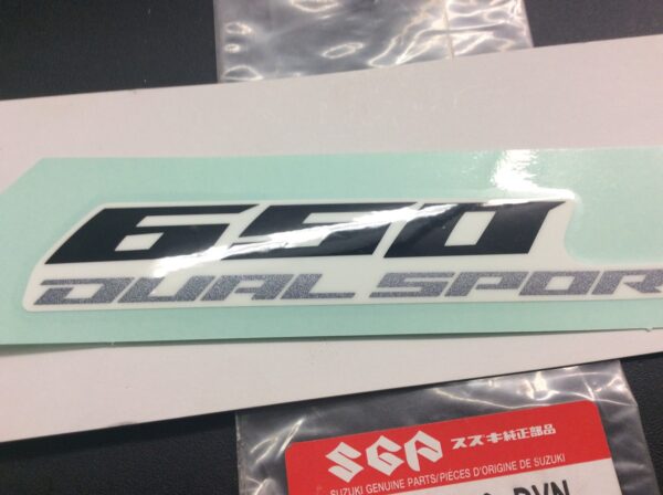 2007 Suzuki Emblem, Side Cover DR650SE (Black/Gray/White/Orange/Blue) - Image 2